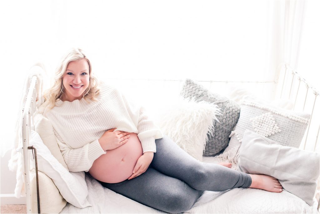 lifestyle maternity photographer, Decatur Il with momma in leggings and showing off baby bump