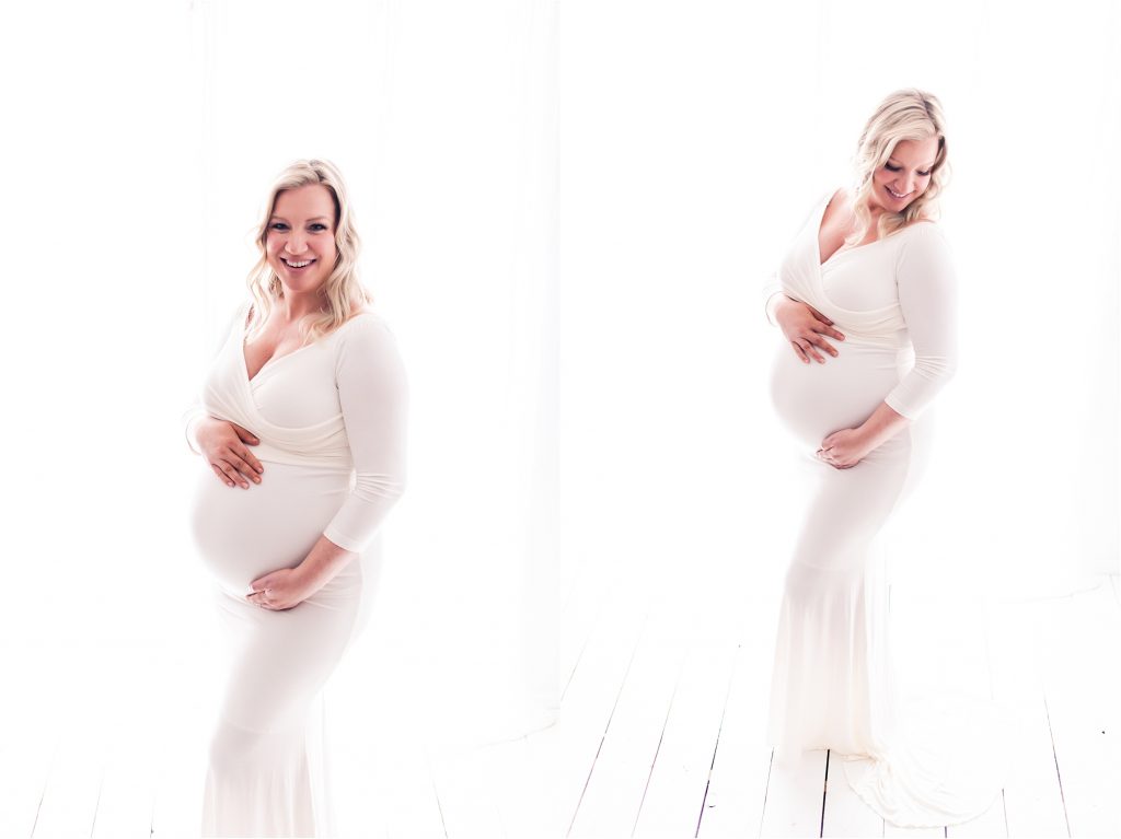 Decatur Il Studio Maternity session with mom holding her baby belly and back lit while wearing white gown