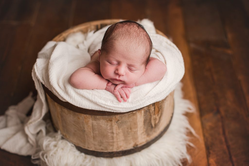 newborn in farmhouse bucket