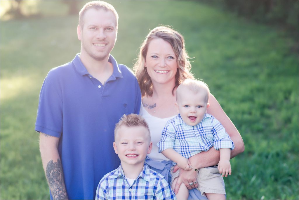 Family smiling together for their family session in Taylorville, Il