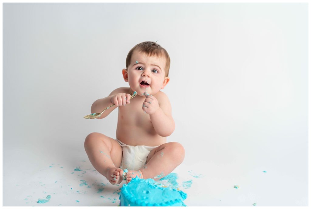 baby boy eating blue cake
