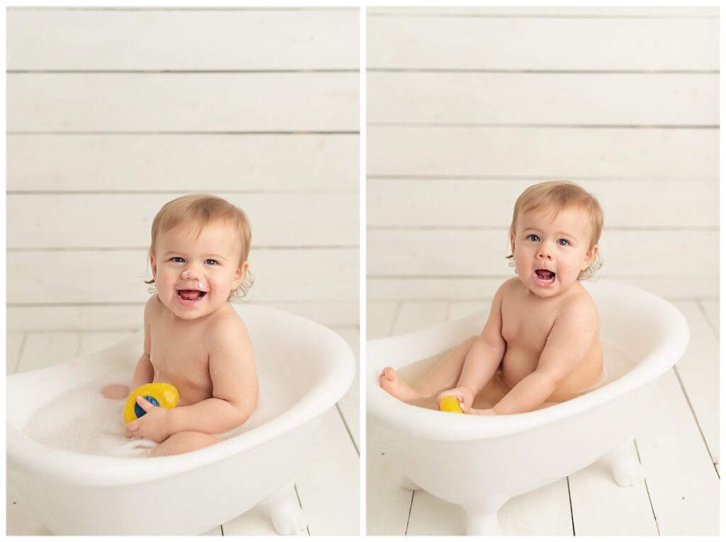 Baby girl playing in bathtub