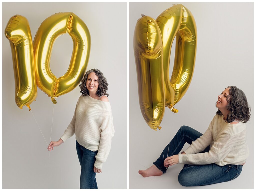 Jennifer Lange holding gold 10 balloons on white seamless paper to celebrate HGP's 10th anniversary